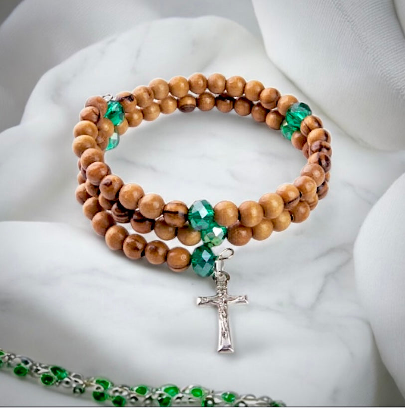 HELIX STRETCH WRAP BRACELET WITH OLIVE WOOD AND AQUA BEADS AND CRUCIFIX DANGLE IN VELVET BOX